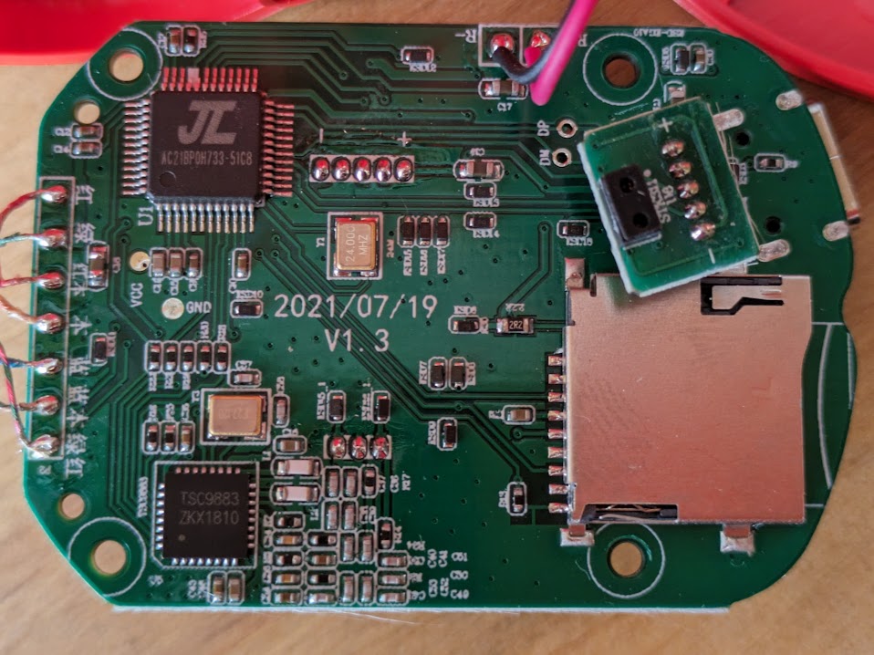 PCB of one of the ears, which has the important chips on it. Description is in the text.